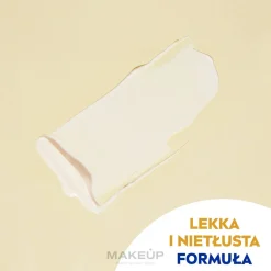 Sonnenschutz-Fluid Kontrolle dunkler Flecken